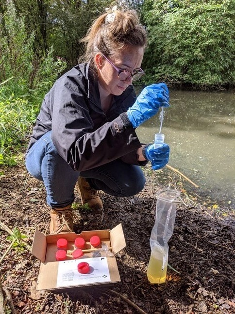 Nikki collecting water sample for GCN eDNA